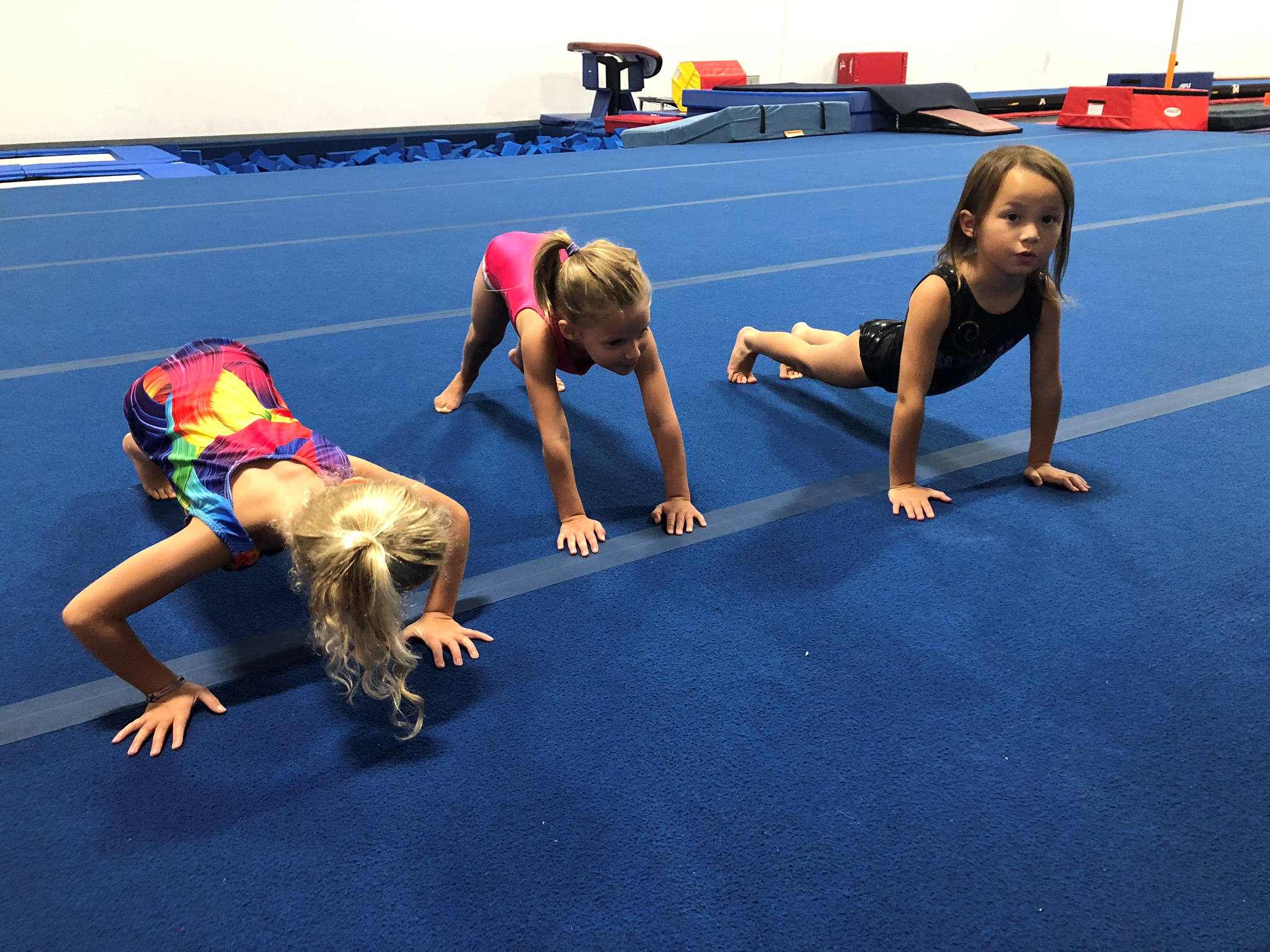 Children doing gymnastics poses