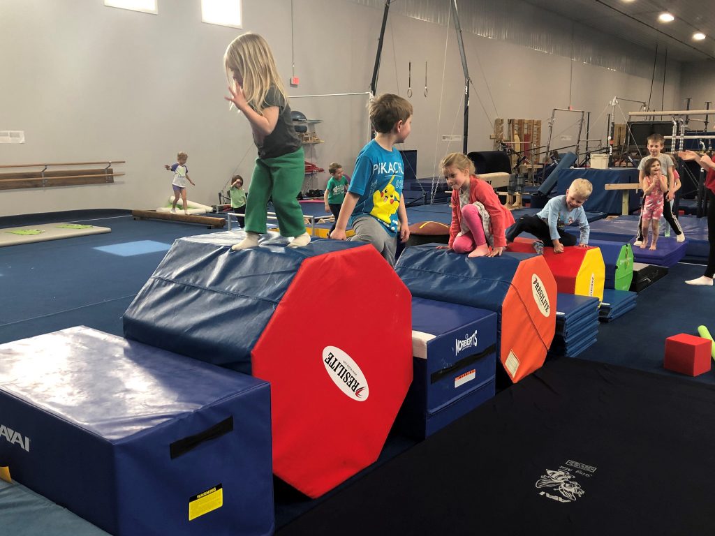 Kids enjoying the gymnastics space at a birthday party