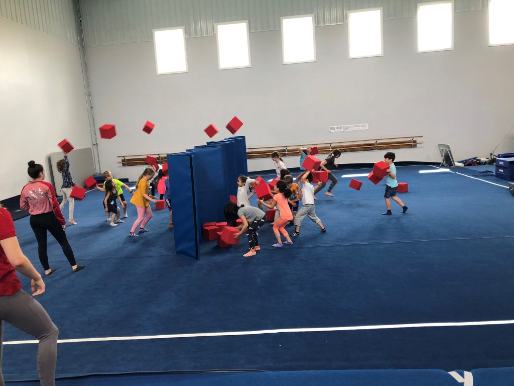Kids enjoying the gymnastics space at a birthday party