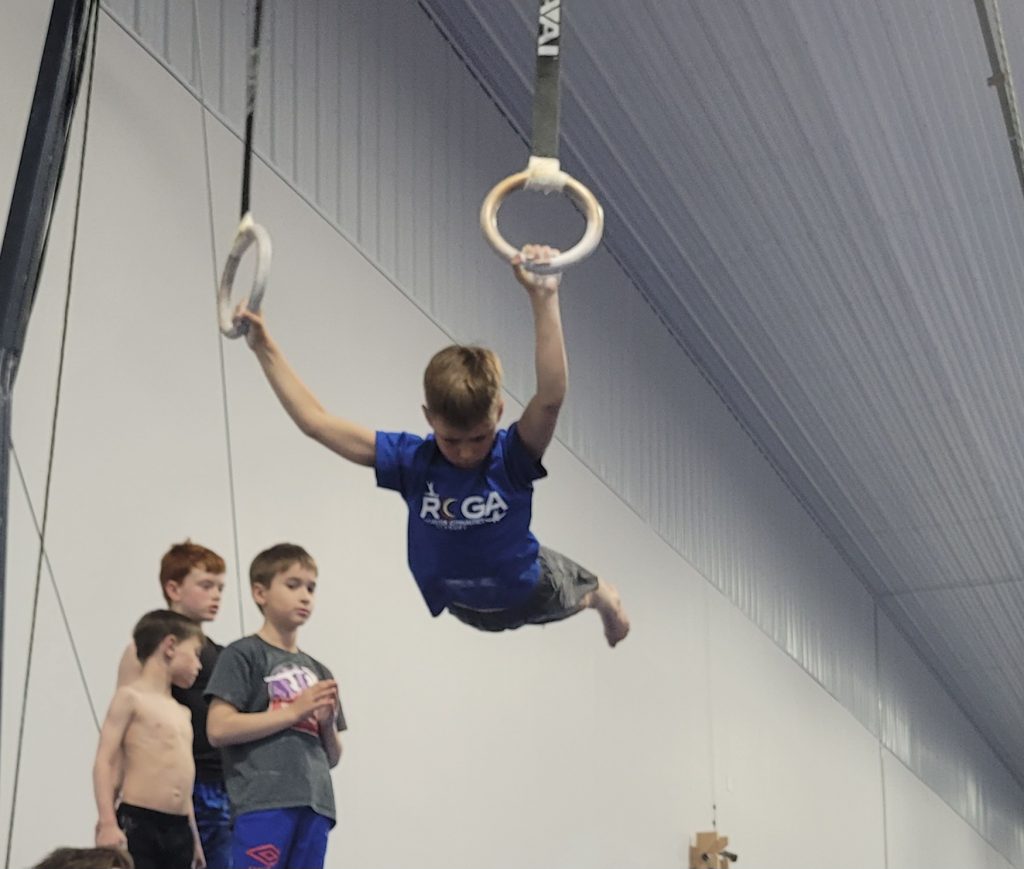 A boy on rings at ROGA