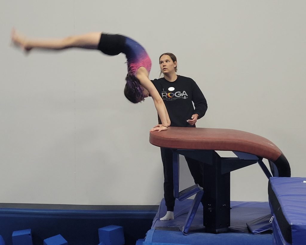 A child practicing gymnastics