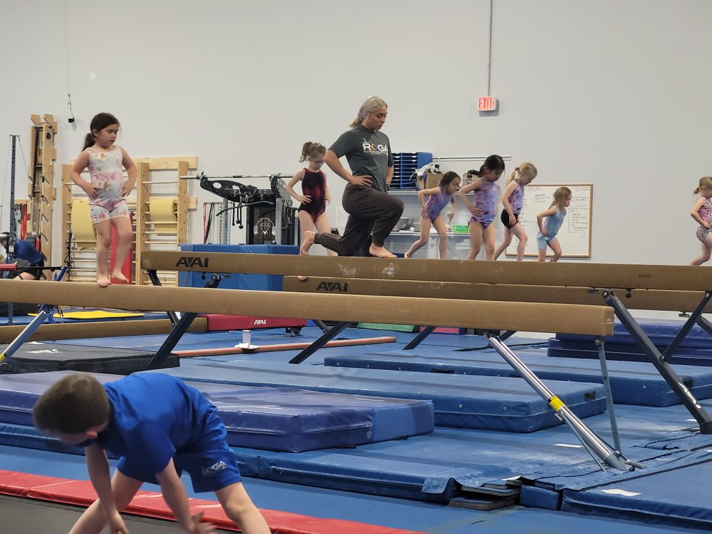 Children practicing on a balance beam