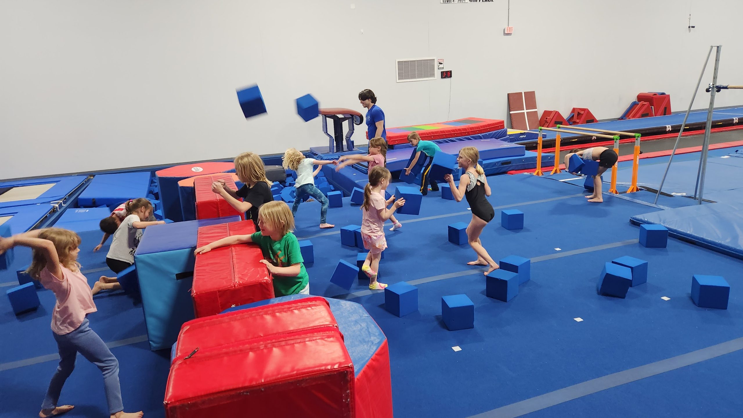 Kids playing on gymnastics floor at Kids Night Out