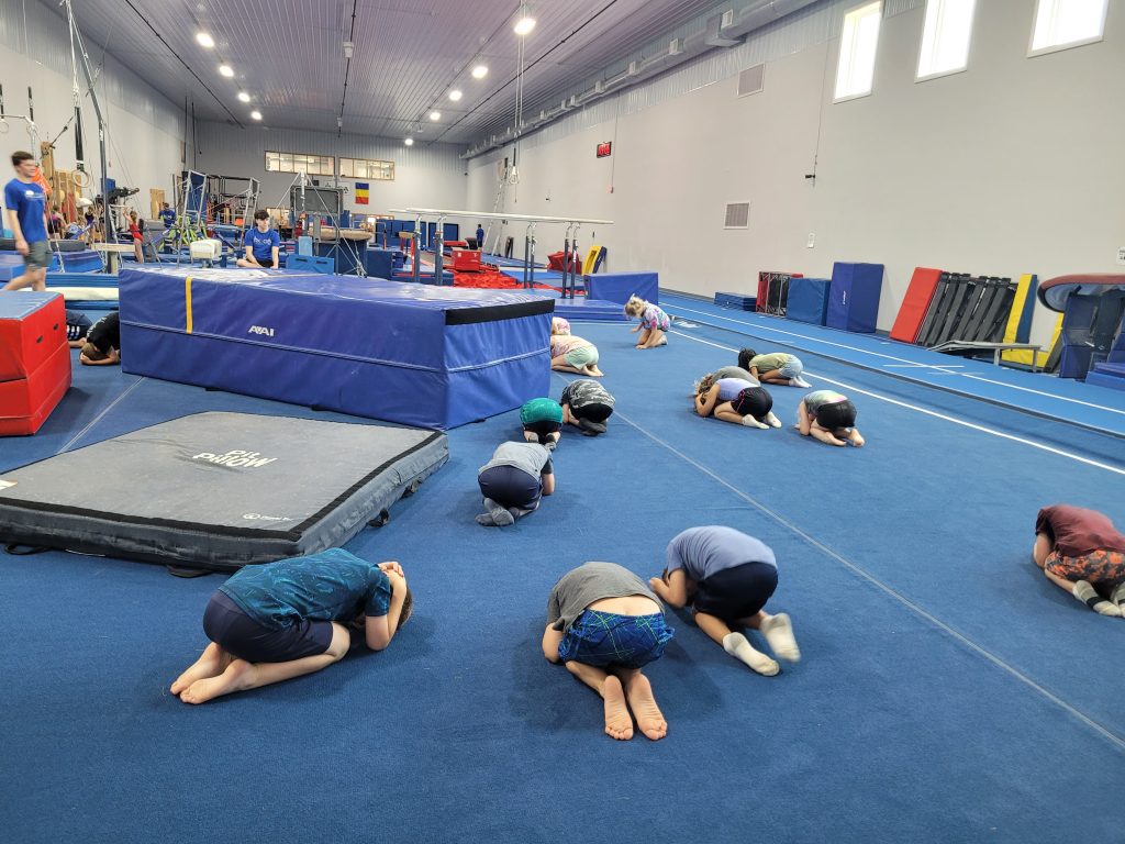 Kids on gymnastics floor at Camp ROGA