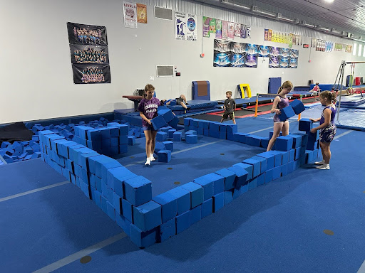 Campers constructing a foam block fort