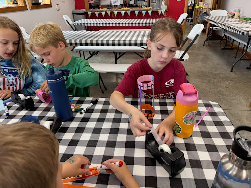 Kids Constructing Paper airplanes