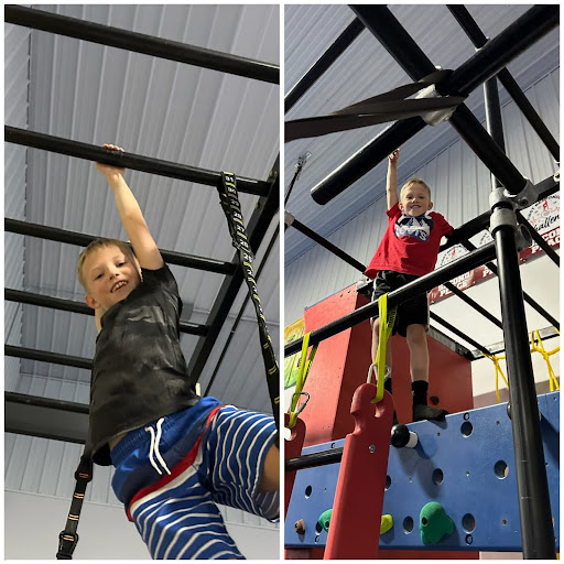 Two boys climbing the Ninja Rig at Camp ROGA summer camp.