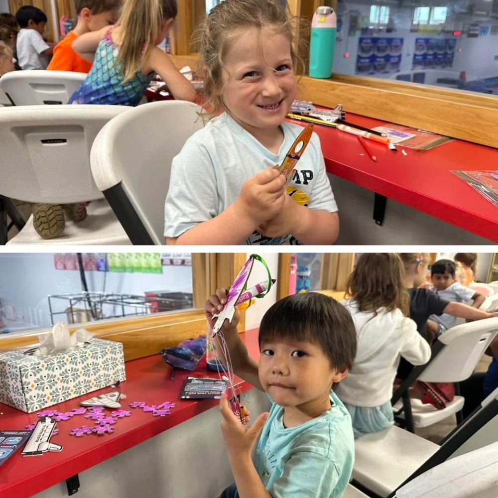 Campers showing off colorful handmade rocket crafts created during Camp ROGA's outer space summer camp.