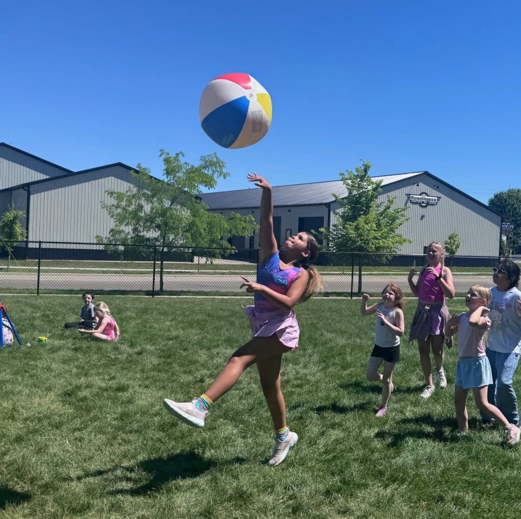 Children enjoy Beach Bash week at Camp ROGA with gymnastics, beach-themed crafts, water games, and summer camp activities.
