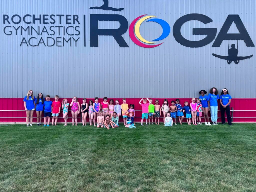 Camp ROGA campers and counselors pose together outside Rochester Gymnastics Academy after an exciting Pirate Treasure Quest week.